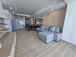 Spacious living area with couch and dining table