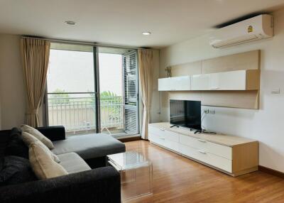 Modern living room with large window and air conditioning