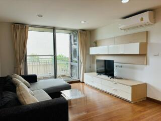 Modern living room with large window and air conditioning