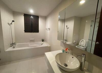 Spacious bathroom with bathtub and sink