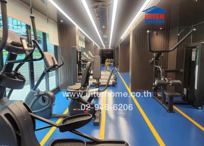 Modern gym with exercise equipment and bright lighting