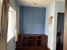 Empty bedroom with blue accent wall