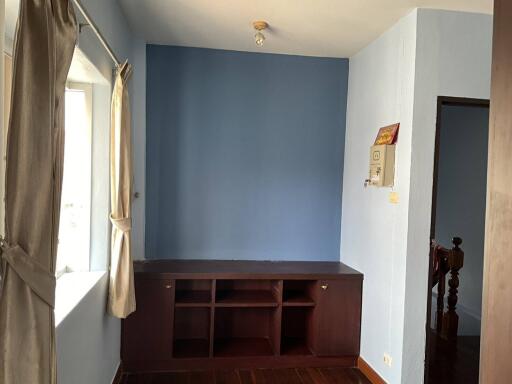 Empty bedroom with blue accent wall