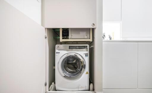 Compact laundry area with washing machine