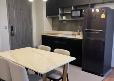 Modern kitchen area with dining table