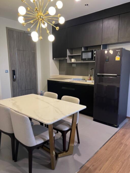 Modern kitchen area with dining table