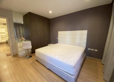 Modern bedroom with king-sized bed and built-in wardrobe