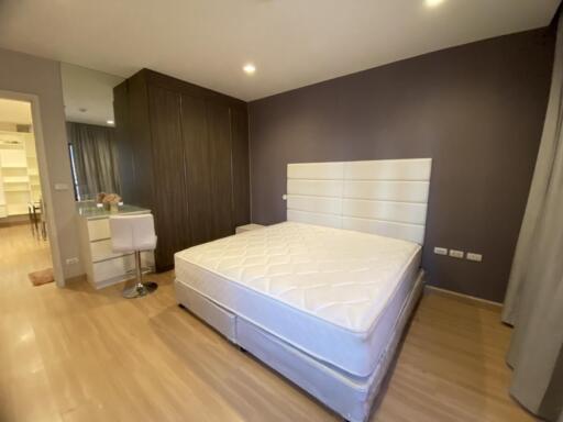 Modern bedroom with king-sized bed and built-in wardrobe