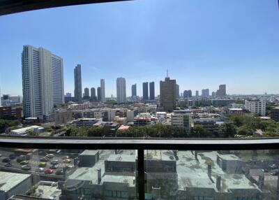 Cityscape view from a high-rise building balcony