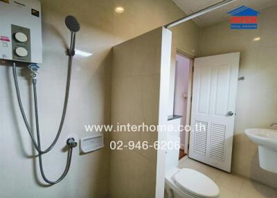 Modern bathroom with shower, toilet, and sink