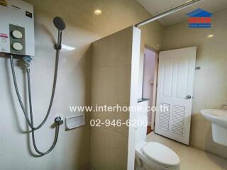 Modern bathroom with shower, toilet, and sink