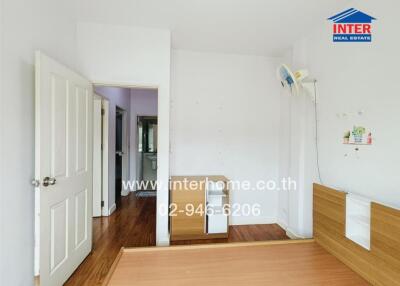 Bedroom with bed frame and doorway view