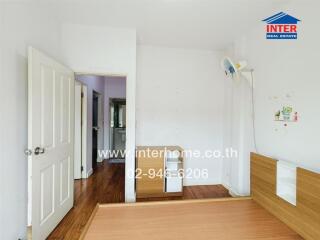 Bedroom with bed frame and doorway view