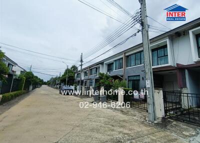 Street view of residential neighborhood with multiple row houses