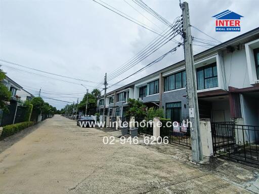 Street view of residential neighborhood with multiple row houses