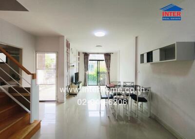 Modern living room with dining area and staircase