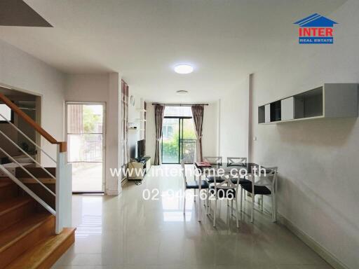 Modern living room with dining area and staircase