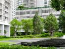 Modern building surrounded by greenery with a fountain