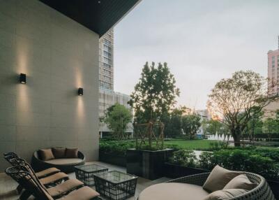 Patio with modern seating area and garden view