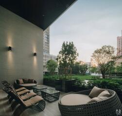 Patio with modern seating area and garden view