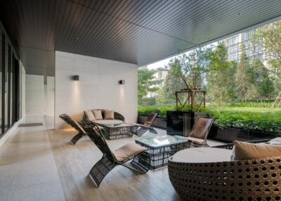 Modern covered patio with outdoor seating and garden view