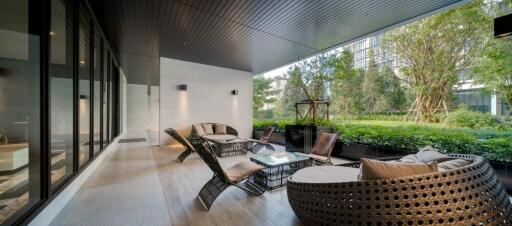 Modern covered patio with outdoor seating and garden view