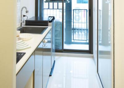 Modern narrow kitchen with balcony access