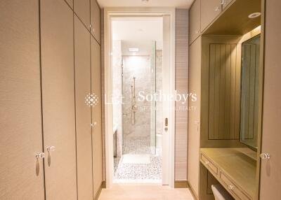 Elegant bathroom with ample storage and walk-in shower