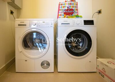 Laundry room with modern washer and dryer