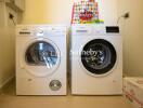 Laundry room with modern washer and dryer