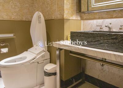 Modern bathroom with smart toilet and marble sink