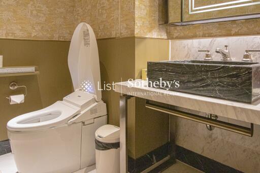 Modern bathroom with smart toilet and marble sink