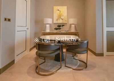 Modern dining area with a round table and stylish chairs