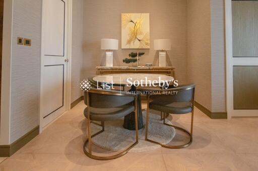 Modern dining area with a round table and stylish chairs