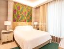 Bedroom with a double bed, side tables, and decorative greenery-themed wallpaper