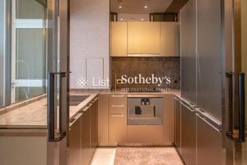 Modern kitchen with sleek cabinets and marble countertops