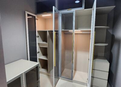 Walk-in closet with storage and shelving