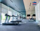 well-equipped gym with cardio machines and cycling stations