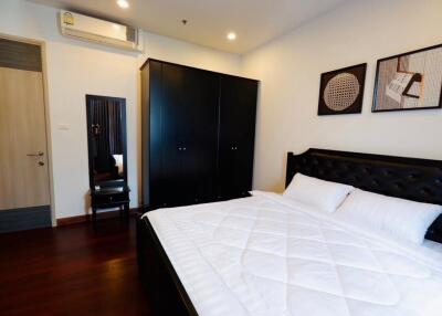 Modern bedroom with double bed and wardrobe