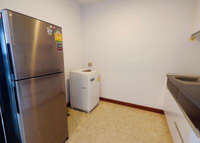 Modern kitchen with refrigerator and washing machine