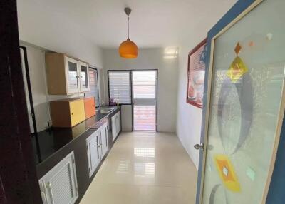 Modern kitchen with ample counter space and natural light