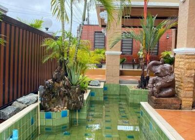 Beautifully landscaped outdoor area with pool