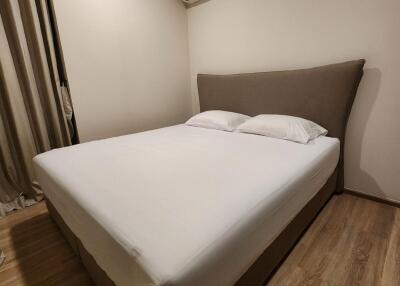 Bedroom with double bed, air conditioning, and wooden flooring