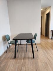 Minimalist dining area with a table and two chairs