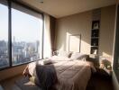 Modern bedroom with large windows and city view