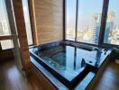 Bathroom with jacuzzi and panoramic city view