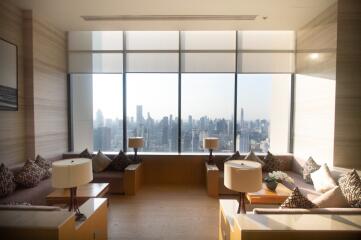 Modern living room with large windows and city view