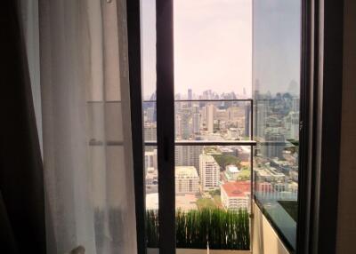 Living room with balcony and city view