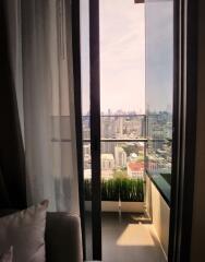 Living room with balcony and city view