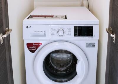 Compact laundry area with washing machine